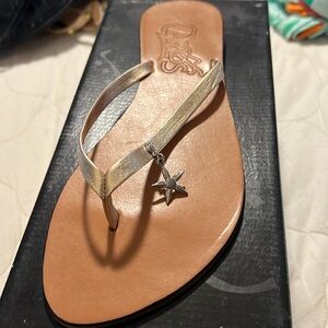 New with box Carlos gold flip flops- size 9M